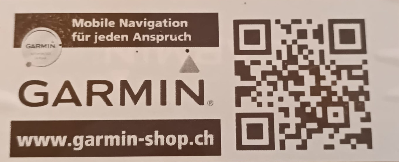 Garmin advertisement banner with slogan 'Mobile Navigation für jeden Anspruch', large GARMIN text, and a QR code beside the site garmin-shop.ch.